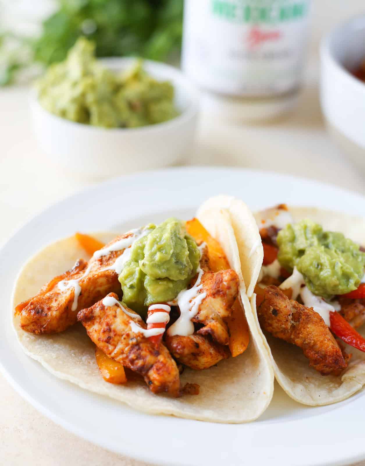 Sheet Pan Chicken Fajitas is an easy, 30 minute dinner all baked on a sheet pan! Chicken, bell peppers, and onion with a delicious fajitas seasoning. Serve them on tortillas with your favorite toppings! 
