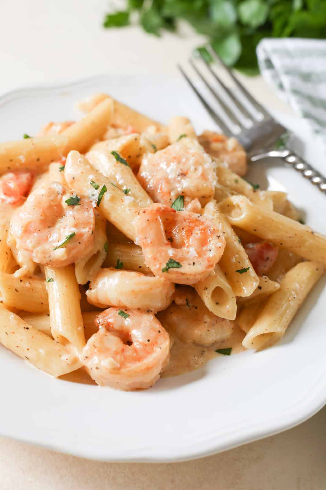 Cajun Shrimp Pasta is an easy, delicious dinner that's ready in about 20 minutes. Shrimp and pasta tossed in a spicy alfredo sauce.