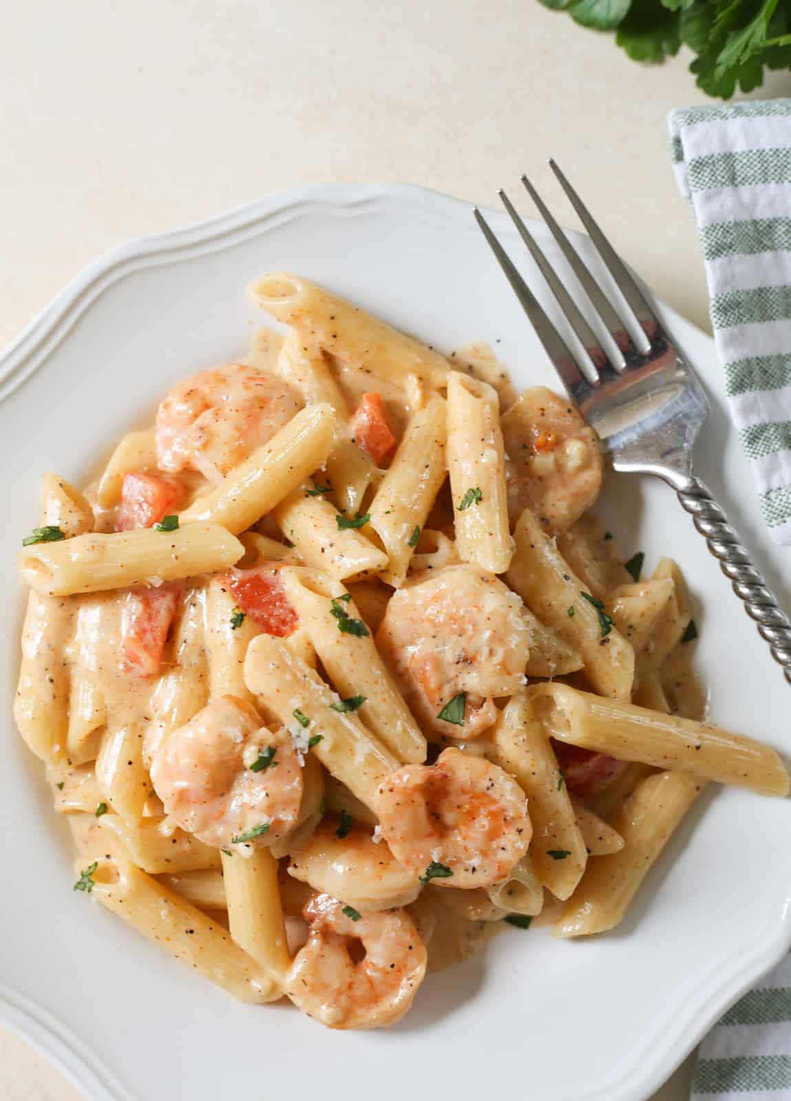 Cajun Shrimp Pasta is an easy, delicious dinner that's ready in about 20 minutes. Shrimp and pasta tossed in a spicy alfredo sauce.