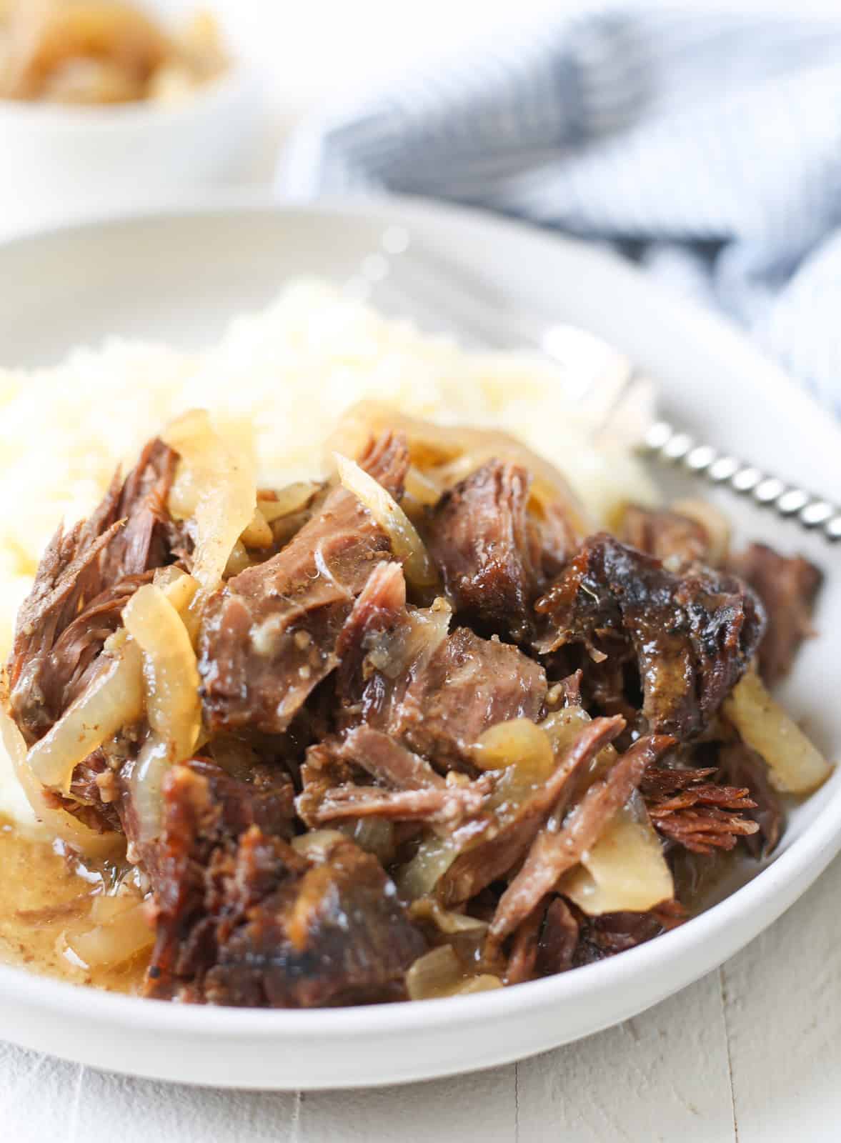 French onion pot roast on a white plate 