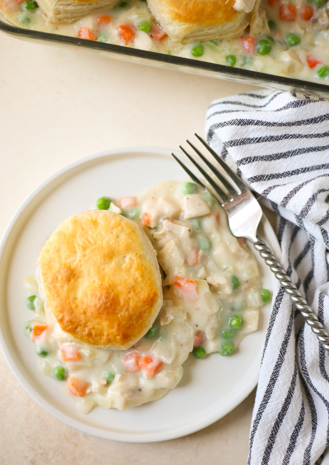 overhead shot of chicken pot pie casserole with a biscuit on top