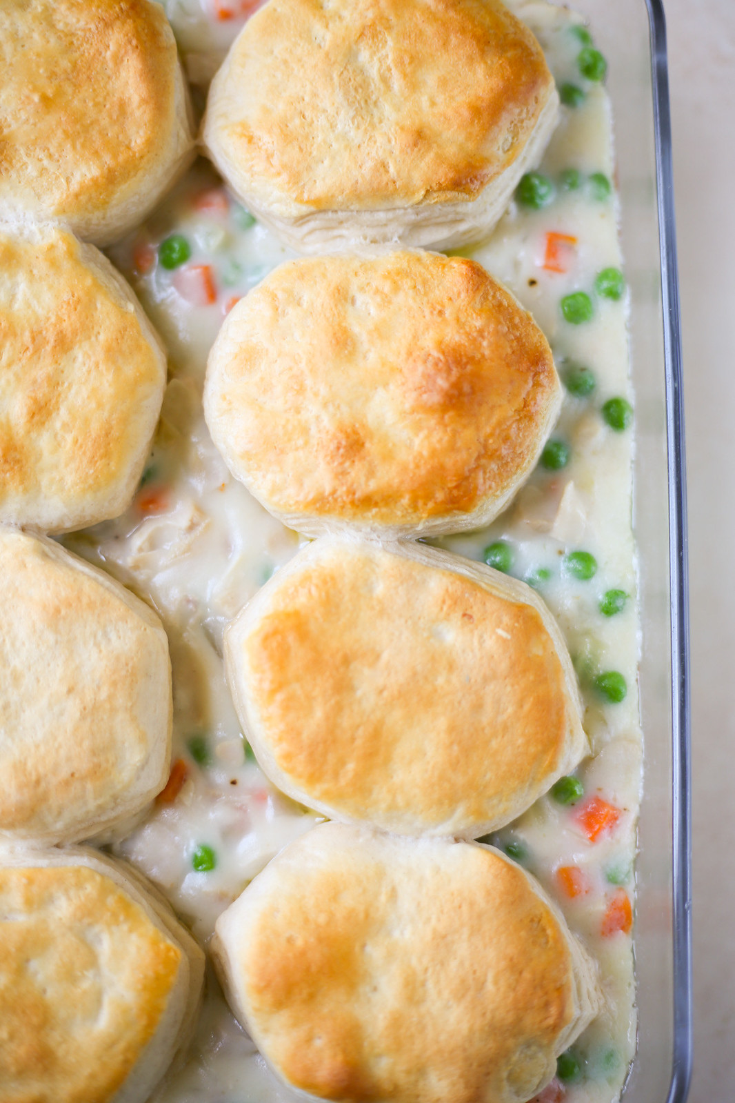 overhead shot of chicken pot pie casserole with biscuits on top 