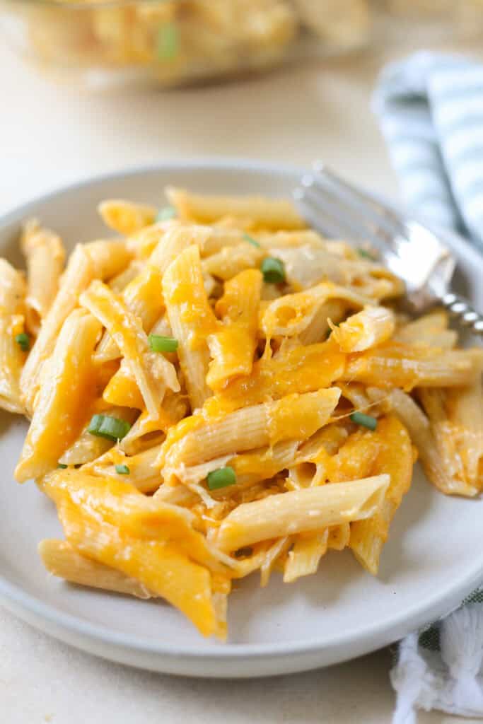 Buffalo Chicken Pasta Bake is an easy 5 ingredient dinner recipe. Pasta, chicken, and a creamy, spicy sauce with lots of cheese. Great for rotisserie chicken!