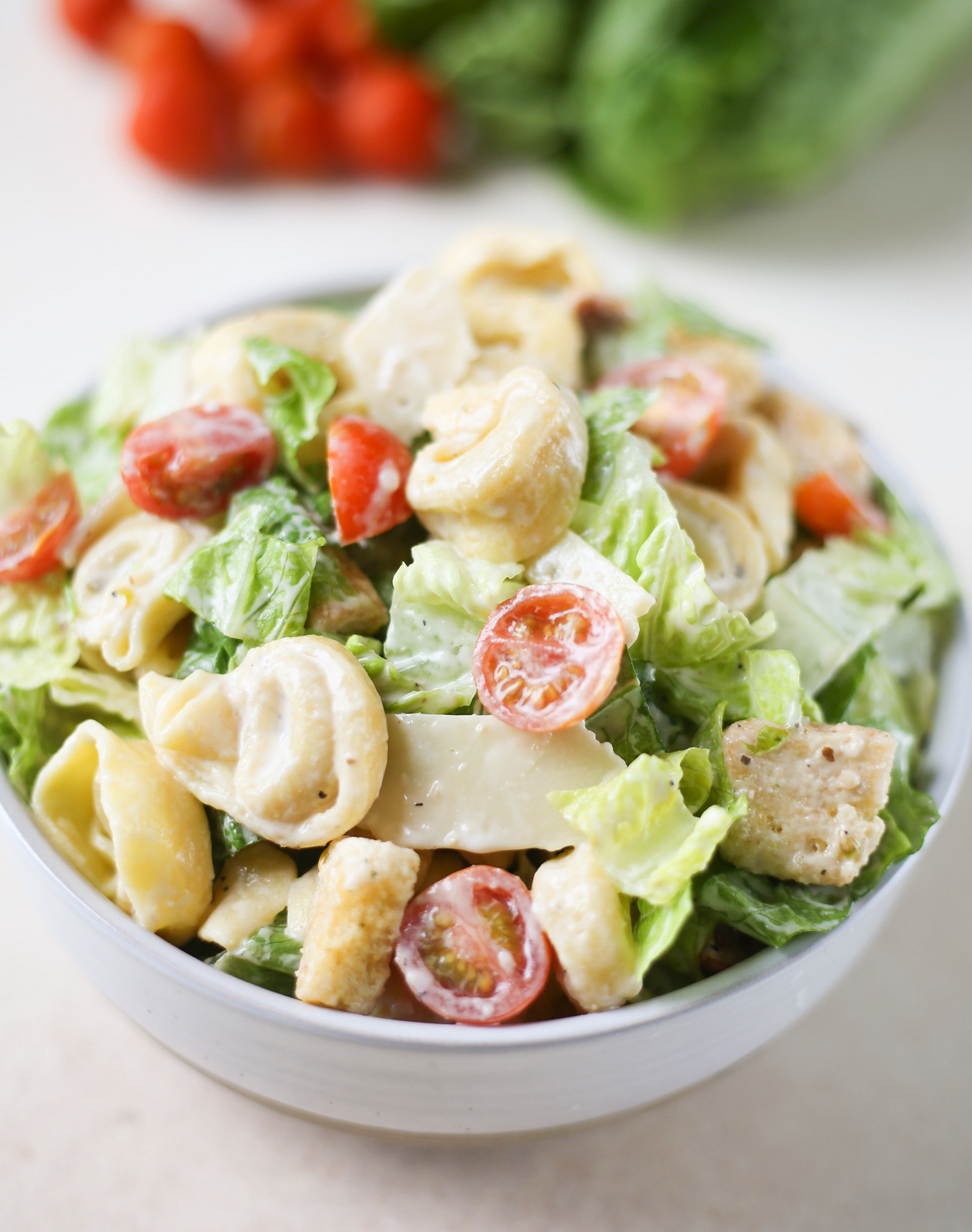 bowl of tortellini caesar salad with croutons